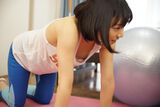 Erotic image of stretching exercises that worries about breast flickers
