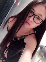 Selfie image of a girl with glasses