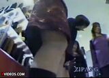 Low-angle voyeur video of a lady who came to a shoe store in a miniskirt