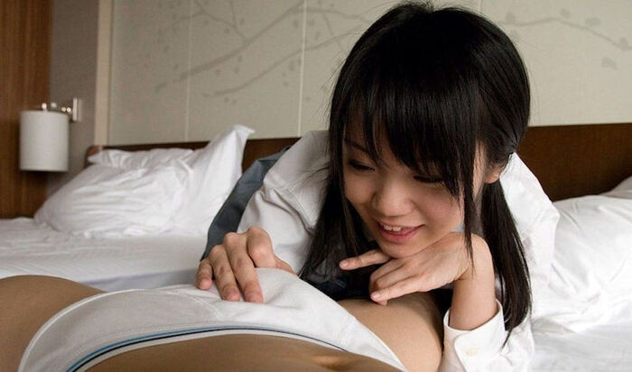 An erotic image of a beautiful woman who likes dicks touching her cheeks from the top of her pants 4th image