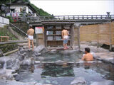 An erotic image in which the outdoor dressing room of the open-air bath is fully visible