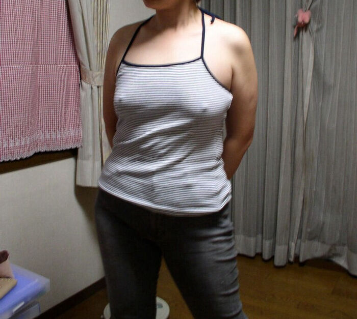 Erotic image of a mature woman wearing a lightly dressed no-bra camisole aunt 12th image