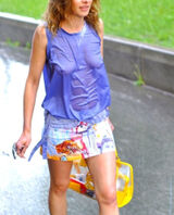 An erotic image of a braless foreigner getting wet in the rain and showing through her nipples