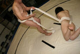 - Erotic images of a female sumo wrestler in a swirling appearance