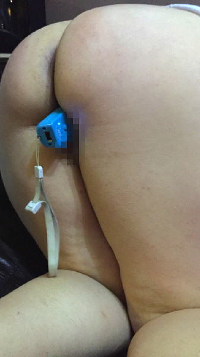 Erotic image of a game controller inserted into a 3th image