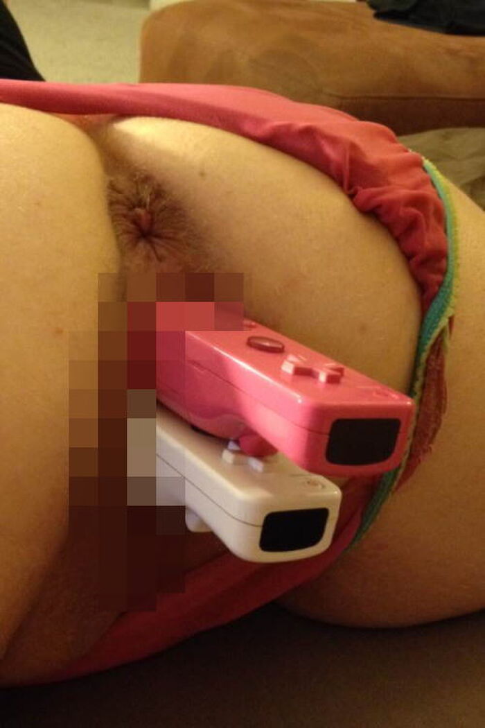 Erotic image of a game controller inserted into a 7th image