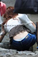 If your sister has pants coming out from behind and you can see them in full view