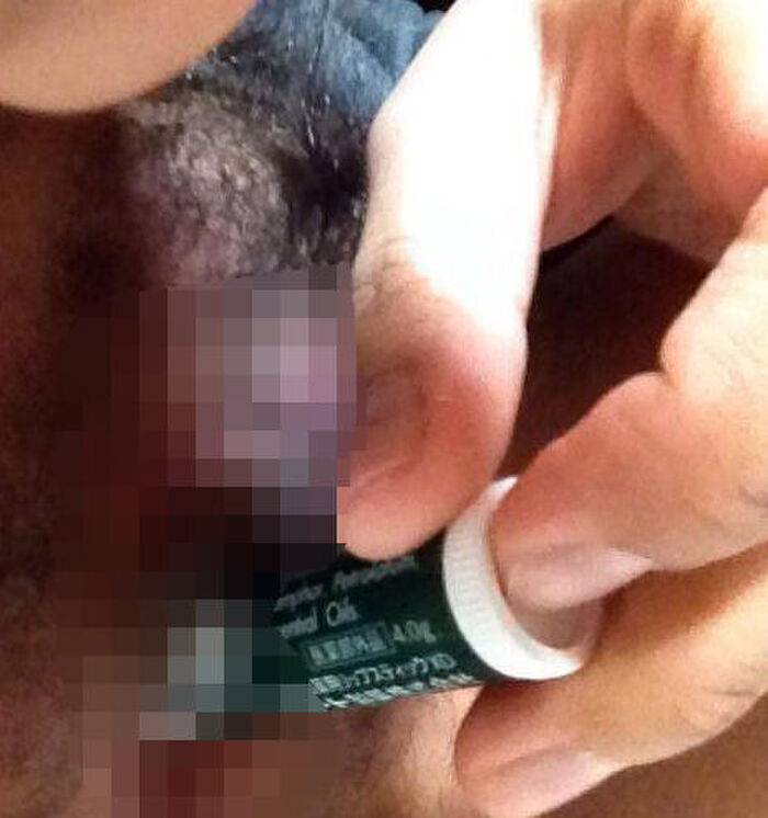 Erotic image of an amateur girl inserting a foreign object in a selfie 16th image
