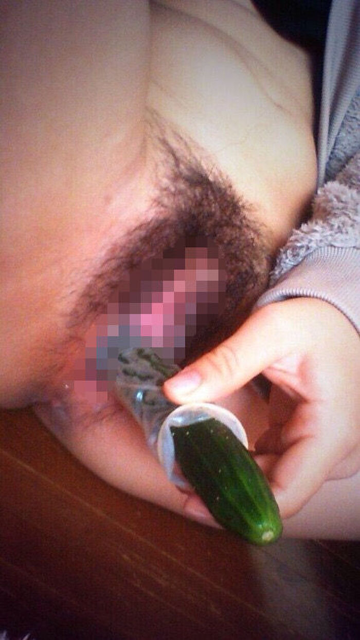 Erotic image of an amateur girl inserting a foreign object in a selfie 26th image