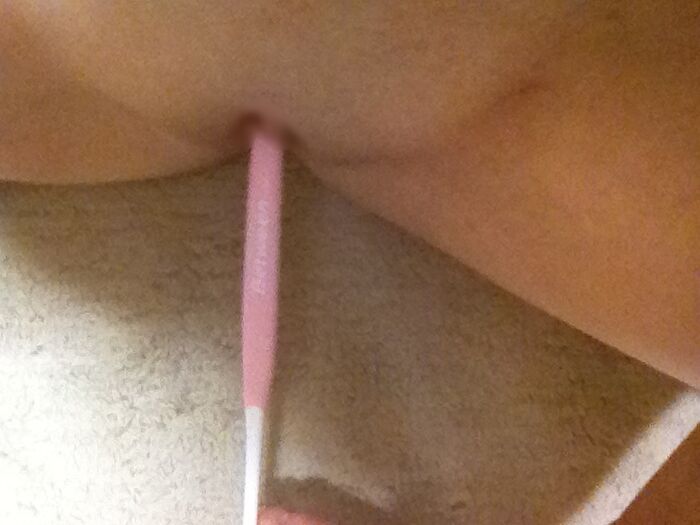 Erotic image of an amateur girl inserting a foreign object in a selfie 27th image