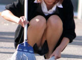 Erotic image of an office lady squatting and cleaning with panchira