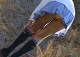 Panty shot image of fixing socks that looked like pants at the moment when the socks were raised