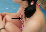 Erotic image of a small breasts swimsuit gal who occasionally flickers her nipples in the sea or pool
