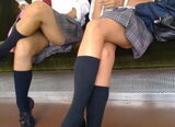 Plural cross-legged erotic image full of thighs and calves
