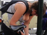 Erotic images taken in overseas cities where the cleavage of a clothed busty foreign woman is amazing