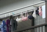 Erotic images of underwear drying outside with bras and pants on the balcony