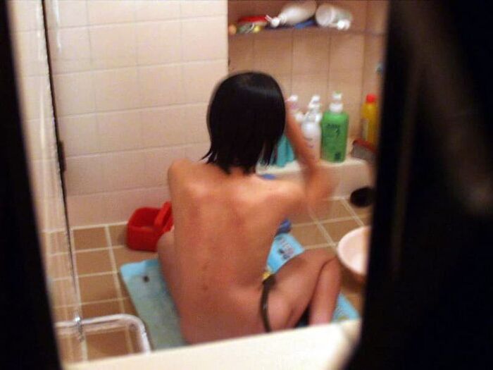 Voyeur of a girl's erotic nakedness from the gap in the window in the bath of a private house 16th image