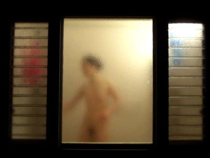 Voyeur of a girl's erotic nakedness from the gap in the window in the bath of a private house 18th image