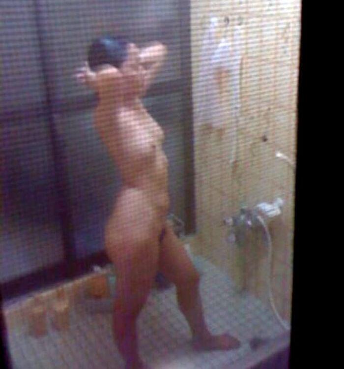 Voyeur of a girl's erotic nakedness from the gap in the window in the bath of a private house 28th image