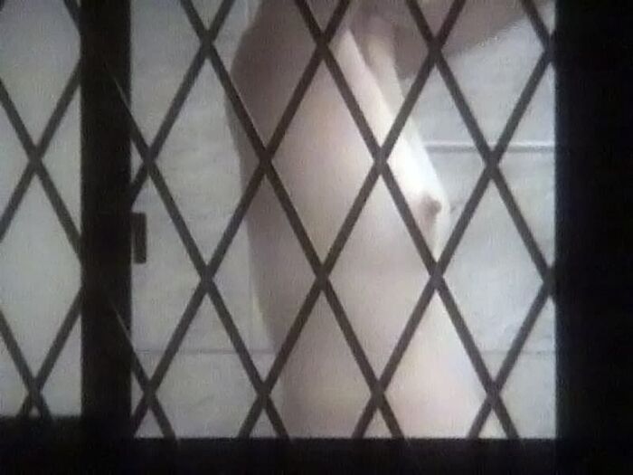 Voyeur of a girl's erotic nakedness from the gap in the window in the bath of a private house 34th image
