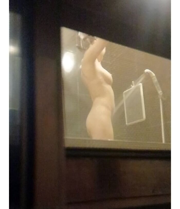 Voyeur of a girl's erotic nakedness from the gap in the window in the bath of a private house 39th image